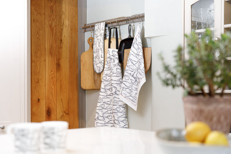 Coastal kitchen apron with seal design