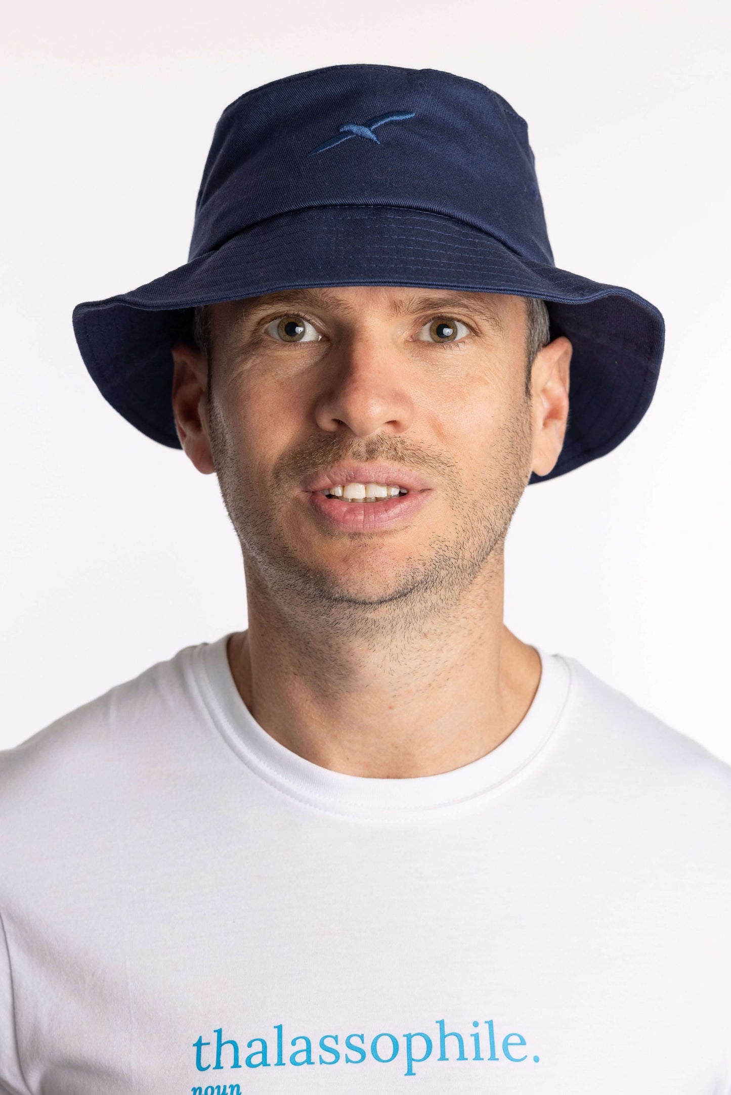 Navy organic cotton bucket hat with Creek bird embroidery