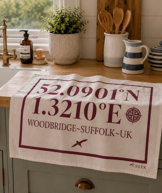 Woodbridge – Latitude & Longitude Coastal Cotton Tea Towel